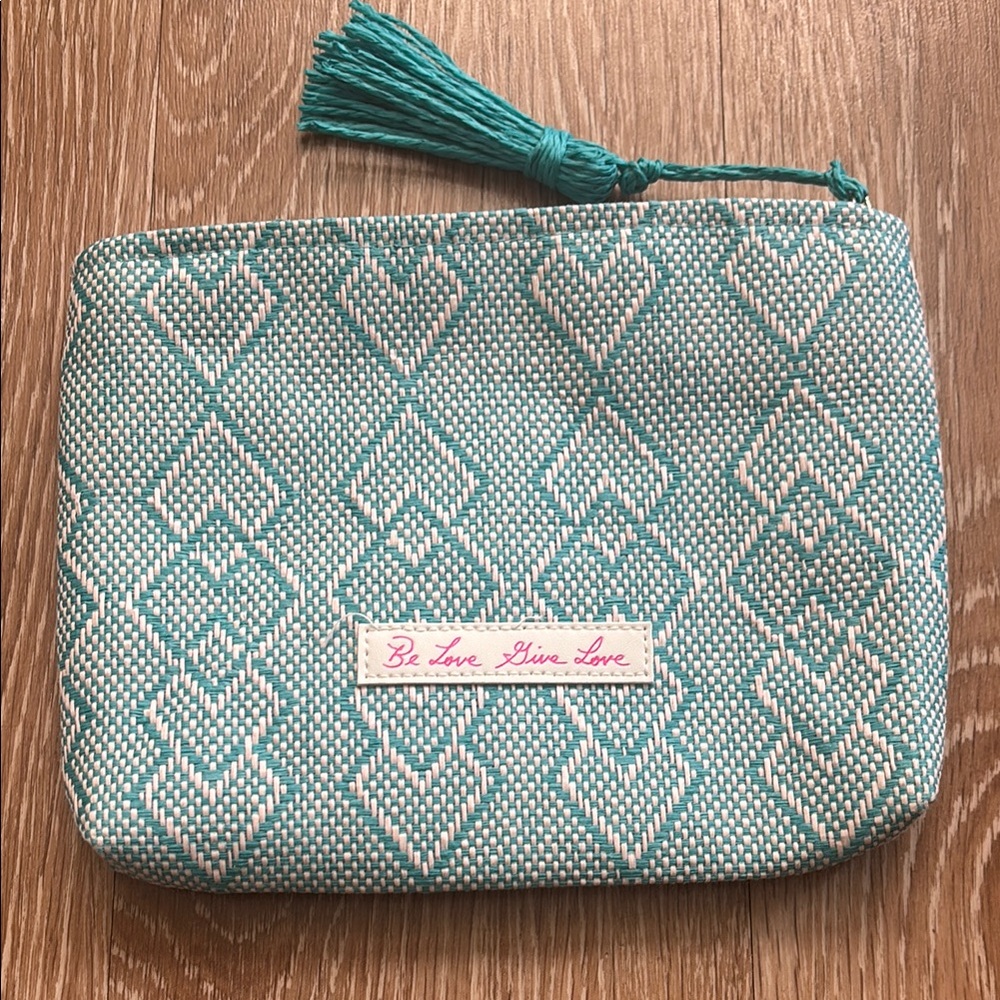Josie Maran white/turquoise patterned woven cosmetic/makeup bag